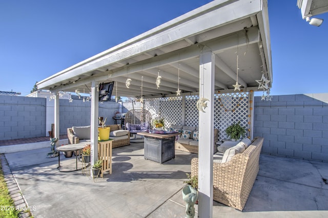 view of patio / terrace featuring an outdoor living space with a fire pit