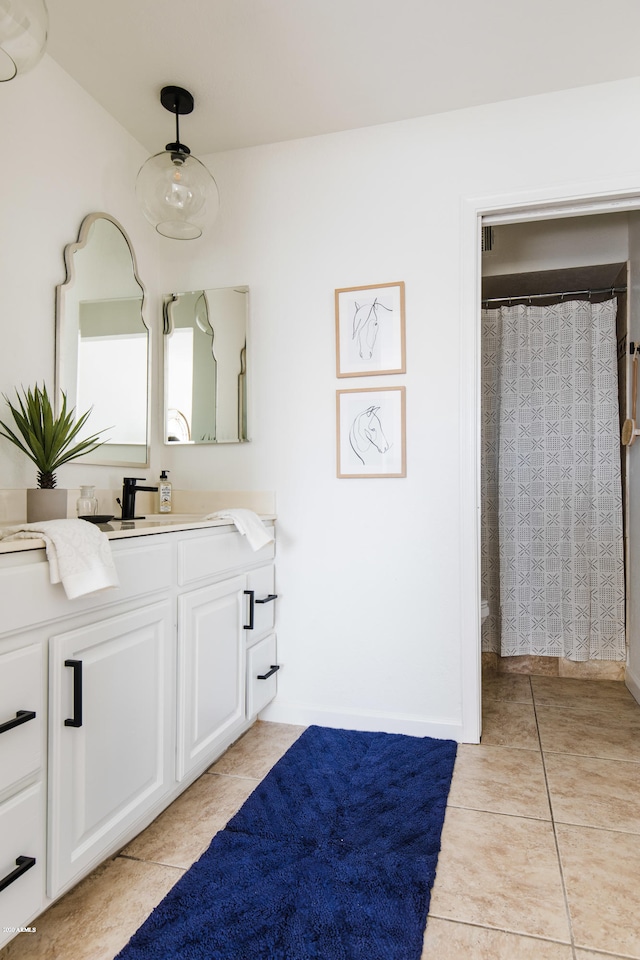 bathroom with tile patterned floors, vanity, and a shower with shower curtain