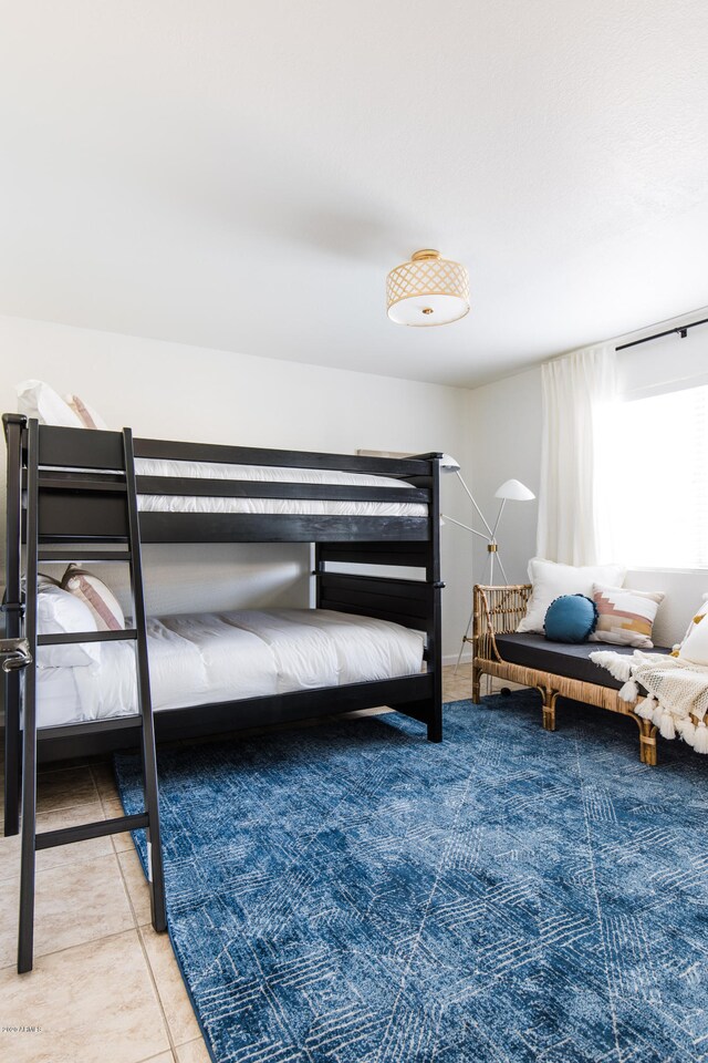 bedroom featuring tile patterned flooring