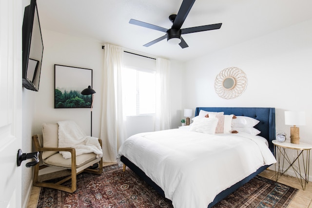 bedroom featuring wood finished floors and a ceiling fan