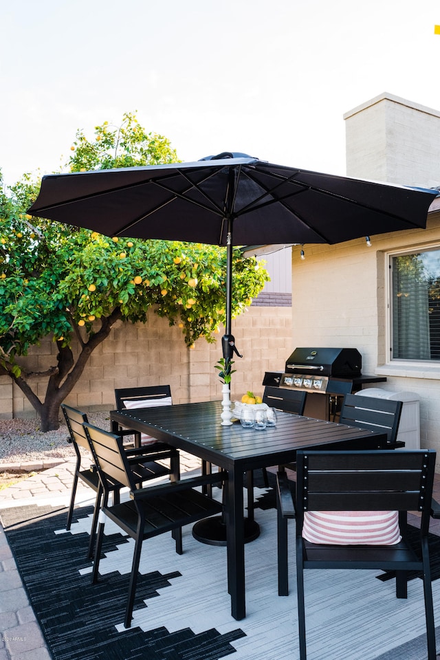 wooden deck with outdoor dining space and fence