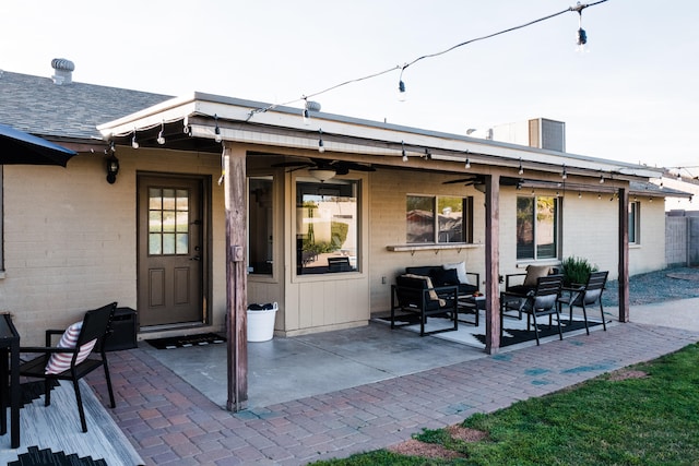 back of property featuring a patio area, brick siding, and a ceiling fan