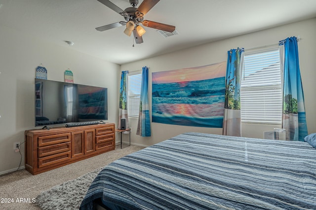 bedroom with ceiling fan and light colored carpet