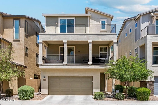 732 W Flintlock Way, Chandler, AZ 85286 - view of front of property featuring a balcony, concrete driveway, and a garage