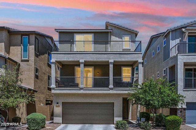 732 W Flintlock Way, Chandler, AZ 85286 - view of front of house with a balcony, driveway, a garage, and stucco siding