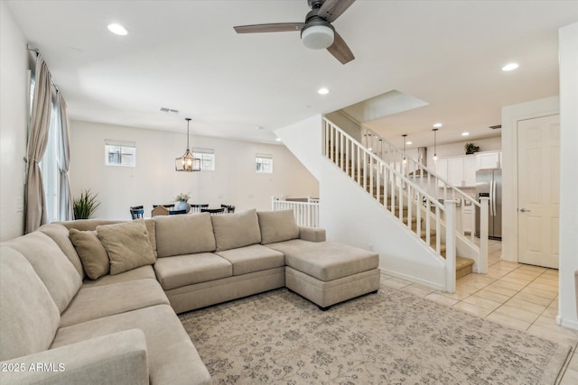 732 W Flintlock Way, Chandler, AZ 85286 - living room with a ceiling fan, stairs, light tile patterned flooring, recessed lighting, and a chandelier