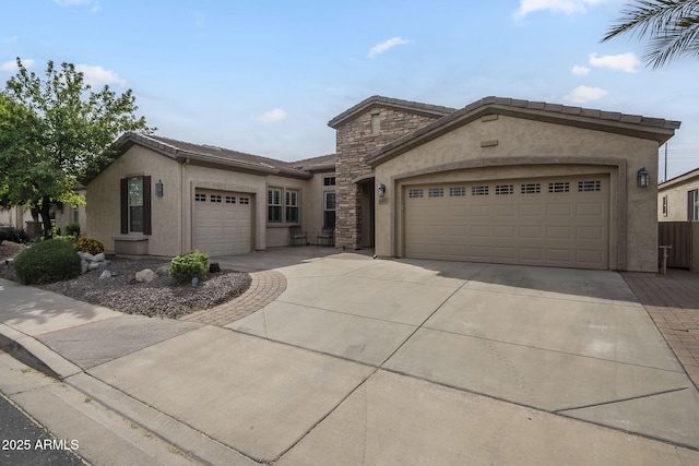 4497 E Ficus Way, Gilbert, AZ 85298 - view of front of property featuring stone siding, stucco siding, concrete driveway, an attached garage, and a tile roof