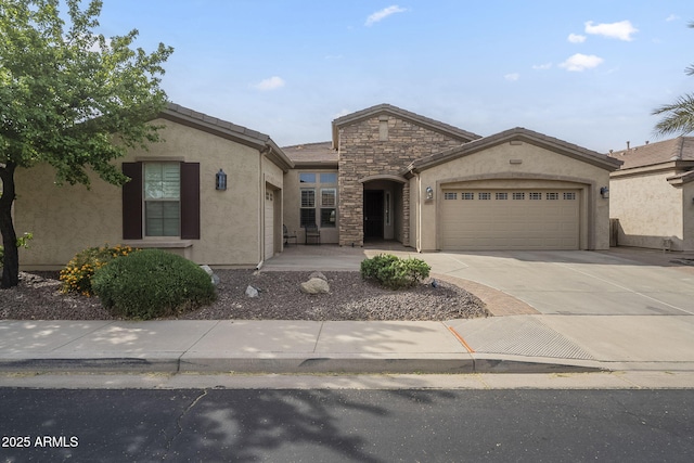 4497 E Ficus Way, Gilbert, AZ 85298 - view of front of house featuring an attached garage, stucco siding, stone siding, and concrete driveway