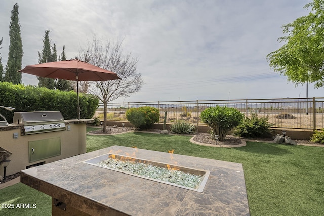 4497 E Ficus Way, Gilbert, AZ 85298 - view of yard featuring an outdoor fire pit, fence, and area for grilling