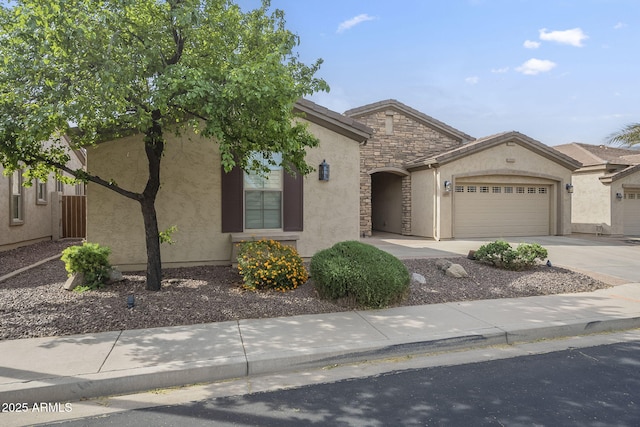 4497 E Ficus Way, Gilbert, AZ 85298 - view of front of house featuring a garage, stucco siding, driveway, and stone siding