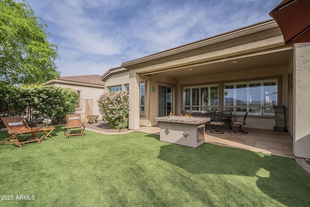 4497 E Ficus Way, Gilbert, AZ 85298 - back of house featuring a lawn, stucco siding, and a patio area