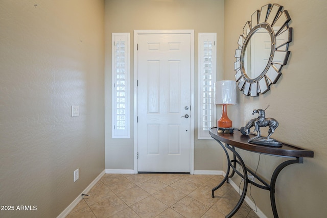 4497 E Ficus Way, Gilbert, AZ 85298 - entryway featuring baseboards, plenty of natural light, and light tile patterned floors