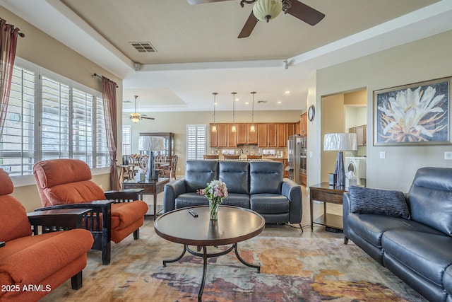 4497 E Ficus Way, Gilbert, AZ 85298 - living area featuring visible vents, washer / dryer, ceiling fan, recessed lighting, and a raised ceiling