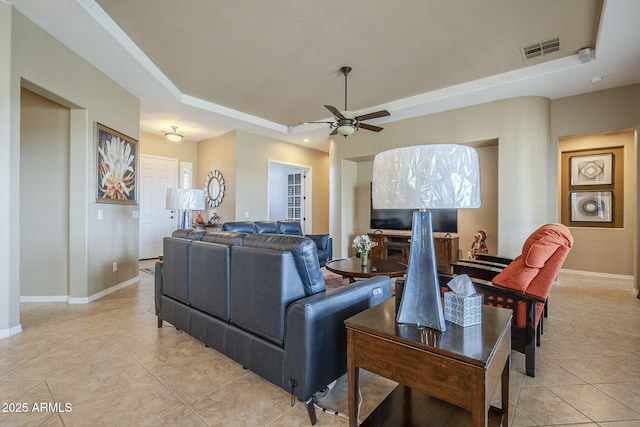 4497 E Ficus Way, Gilbert, AZ 85298 - living area featuring light tile patterned flooring, a raised ceiling, a ceiling fan, baseboards, and visible vents