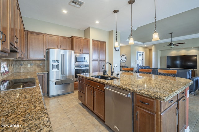 4497 E Ficus Way, Gilbert, AZ 85298 - kitchen featuring ceiling fan, appliances with stainless steel finishes, a sink, tasteful backsplash, and visible vents