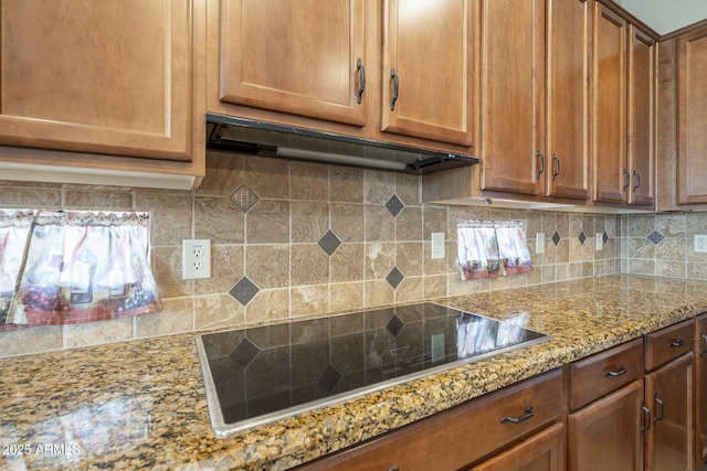 4497 E Ficus Way, Gilbert, AZ 85298 - kitchen featuring under cabinet range hood, black electric cooktop, brown cabinetry, and backsplash