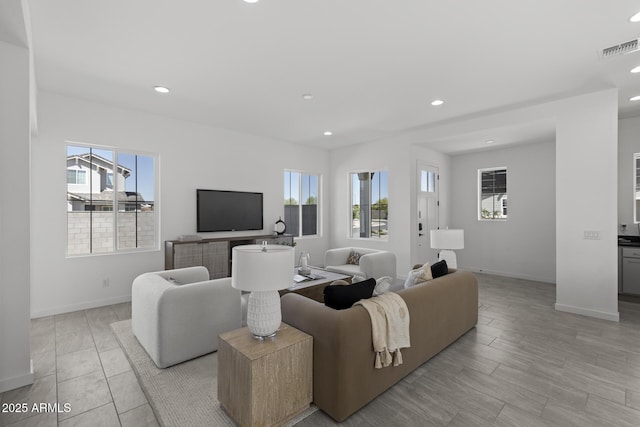 2149 W Rowel Rd, Phoenix, AZ 85085 - living area with recessed lighting, visible vents, a wealth of natural light, and baseboards
