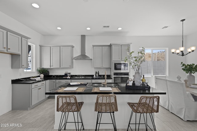 2149 W Rowel Rd, Phoenix, AZ 85085 - kitchen with wall chimney exhaust hood, a sink, appliances with stainless steel finishes, and a wealth of natural light