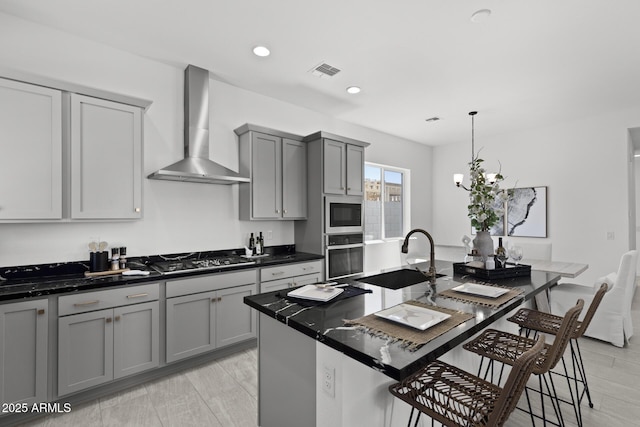 2149 W Rowel Rd, Phoenix, AZ 85085 - kitchen with gray cabinets, stainless steel appliances, wall chimney range hood, a sink, and visible vents