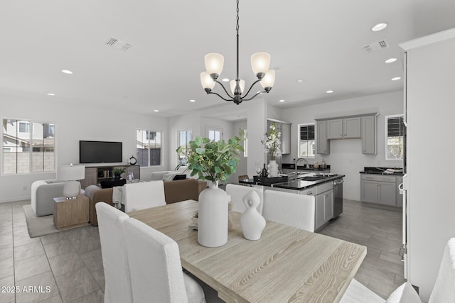 2149 W Rowel Rd, Phoenix, AZ 85085 - dining room with recessed lighting, visible vents, and a chandelier
