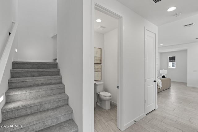2149 W Rowel Rd, Phoenix, AZ 85085 - staircase with wood finished floors, visible vents, recessed lighting, and baseboards