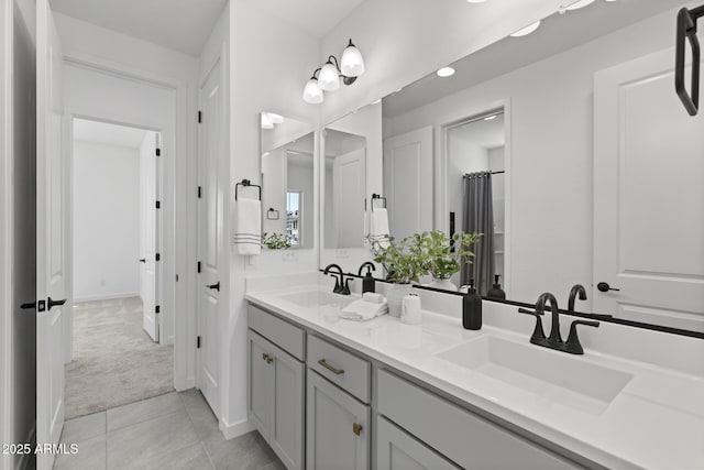 2149 W Rowel Rd, Phoenix, AZ 85085 - full bathroom with tile patterned flooring, double vanity, a sink, and baseboards