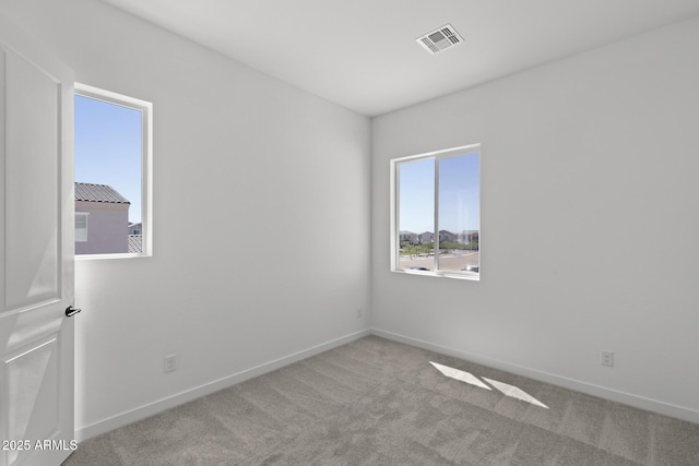 2149 W Rowel Rd, Phoenix, AZ 85085 - unfurnished room featuring baseboards, visible vents, and carpet
