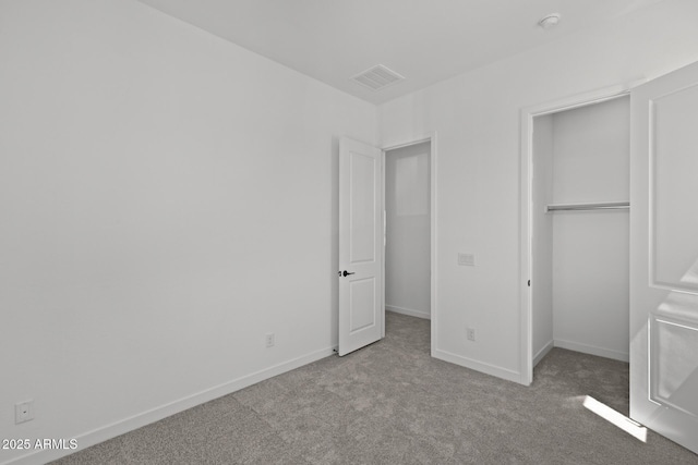 2149 W Rowel Rd, Phoenix, AZ 85085 - unfurnished bedroom with baseboards, visible vents, a closet, and carpet