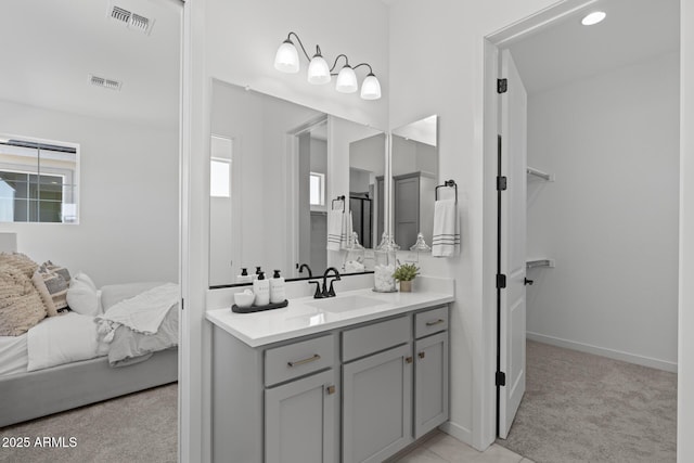 2149 W Rowel Rd, Phoenix, AZ 85085 - bathroom featuring visible vents, vanity, and plenty of natural light