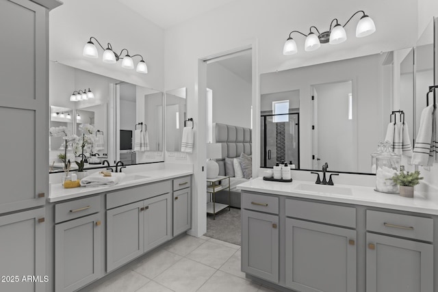 2149 W Rowel Rd, Phoenix, AZ 85085 - full bathroom featuring tile patterned floors, a stall shower, two vanities, and a sink