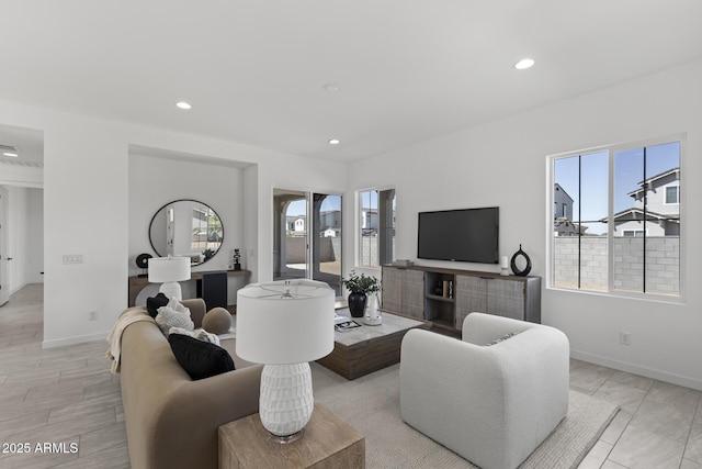 2149 W Rowel Rd, Phoenix, AZ 85085 - living room featuring baseboards and a healthy amount of sunlight