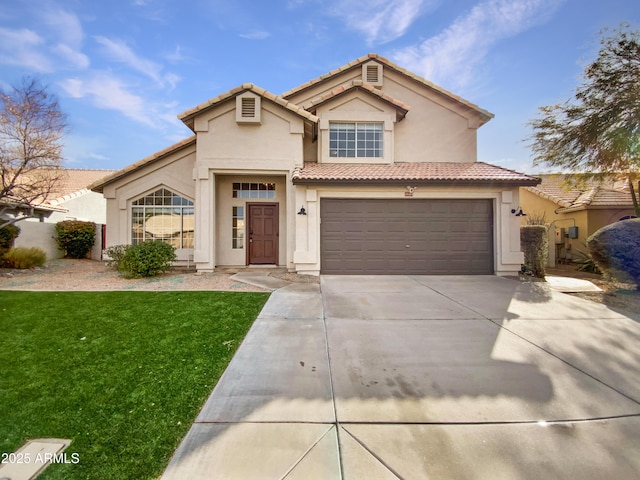 view of front of home with a garage and a front yard