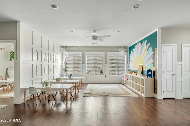 dining room featuring wood finished floors, a ceiling fan, and recessed lighting