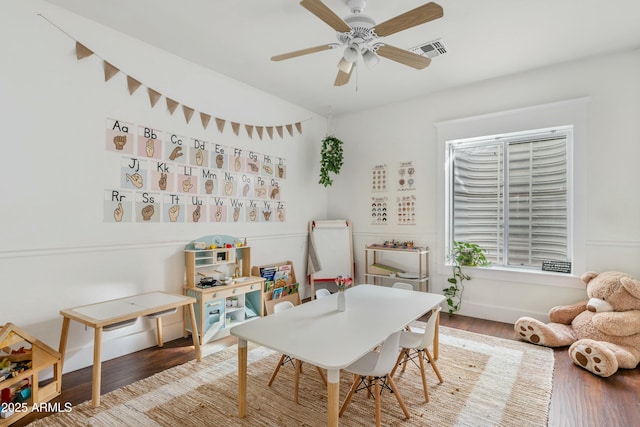 rec room featuring ceiling fan, visible vents, and wood finished floors