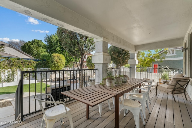 wooden deck with outdoor dining space