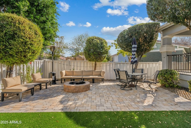 view of patio featuring fence and an outdoor living space