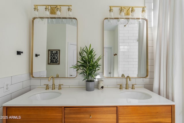 bathroom with a sink and double vanity