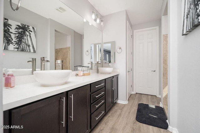 2321 W Brookhart Way, Phoenix, AZ 85085 - bathroom featuring wood finished floors, double vanity, and baseboards