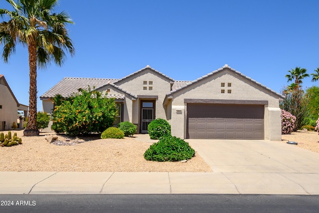 19892 N Shadow Mountain Dr, Surprise, AZ 85374 - view of front of home featuring a garage, stucco siding, driveway, and a tile roof