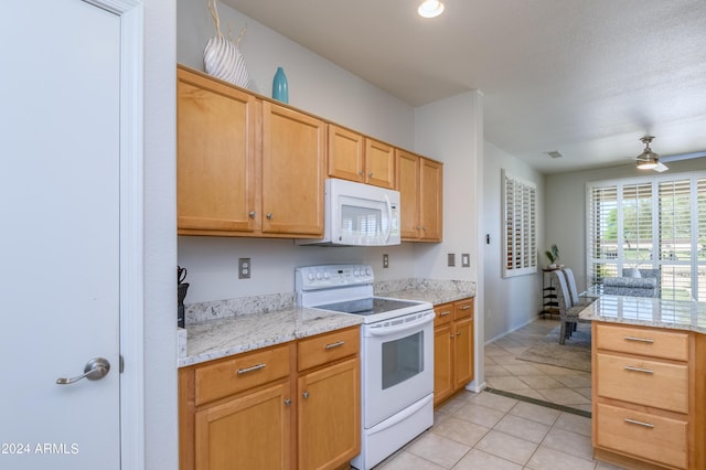 19892 N Shadow Mountain Dr, Surprise, AZ 85374 - kitchen with ceiling fan, white appliances, light countertops, baseboards, and light tile patterned floors