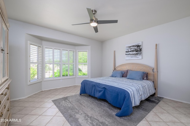 19892 N Shadow Mountain Dr, Surprise, AZ 85374 - bedroom with light tile patterned flooring, baseboards, and a ceiling fan