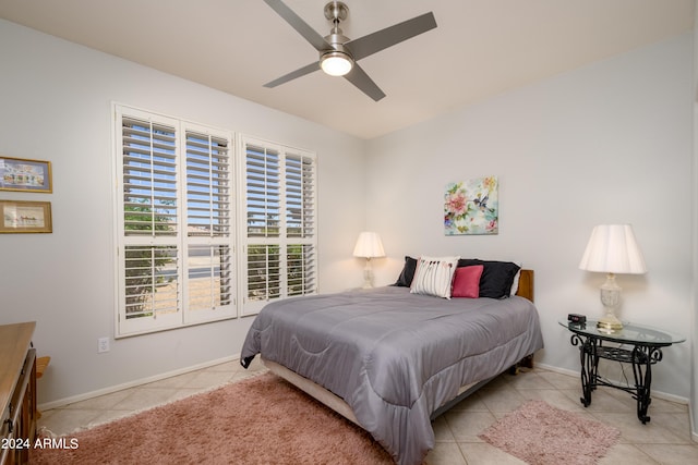 19892 N Shadow Mountain Dr, Surprise, AZ 85374 - tiled bedroom with baseboards and a ceiling fan