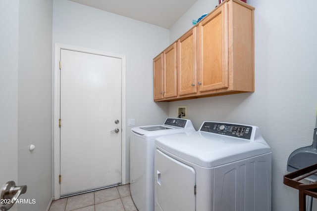 19892 N Shadow Mountain Dr, Surprise, AZ 85374 - clothes washing area with light tile patterned flooring, cabinet space, and washer and clothes dryer