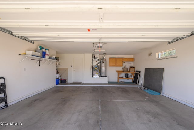 19892 N Shadow Mountain Dr, Surprise, AZ 85374 - garage featuring a garage door opener, heating unit, and gas water heater