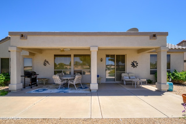 19892 N Shadow Mountain Dr, Surprise, AZ 85374 - back of property featuring ceiling fan, outdoor dining area, a patio area, and stucco siding