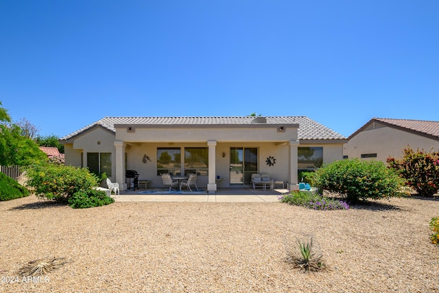 19892 N Shadow Mountain Dr, Surprise, AZ 85374 - back of property featuring a tiled roof, a patio area, and stucco siding