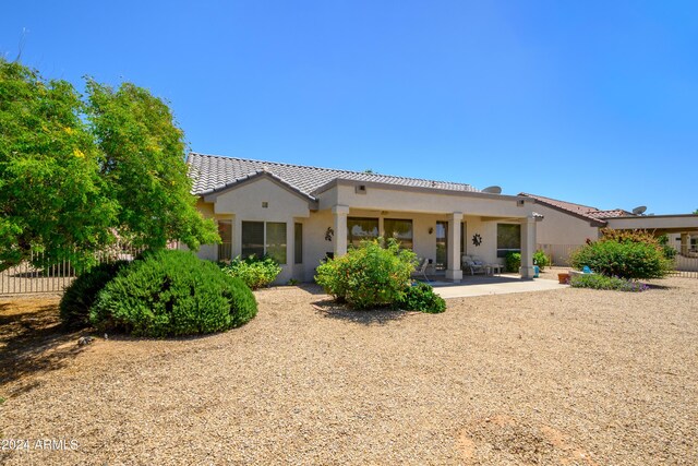 19892 N Shadow Mountain Dr, Surprise, AZ 85374 - rear view of property with a patio area, stucco siding, a tiled roof, and fence