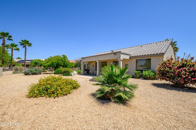 19892 N Shadow Mountain Dr, Surprise, AZ 85374 - rear view of house with fence, stucco siding, and a tiled roof