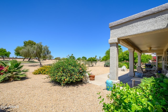 19892 N Shadow Mountain Dr, Surprise, AZ 85374 - view of yard featuring a fenced backyard, a ceiling fan, and a patio