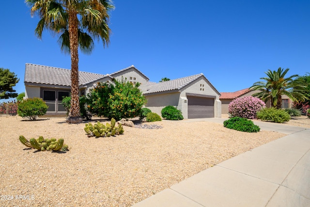 19892 N Shadow Mountain Dr, Surprise, AZ 85374 - view of front of property featuring a garage, stucco siding, driveway, and a tile roof